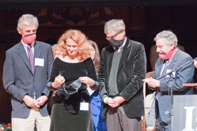 Public Health Prize winner Dr. Elena Bodnar demonstrates her invention. 